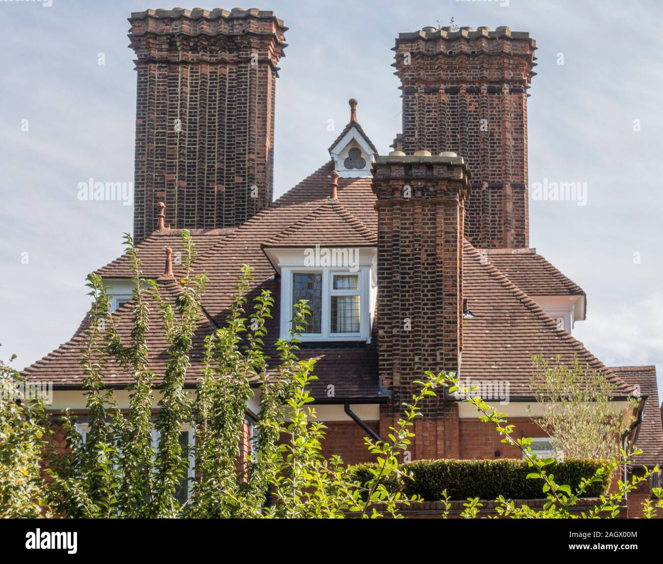 An unusual period house with three brick chimneys, two of which are noticeably large. Klippan House, Well Walk, Hampstead, London, NW3, England, UK. Stock Photo