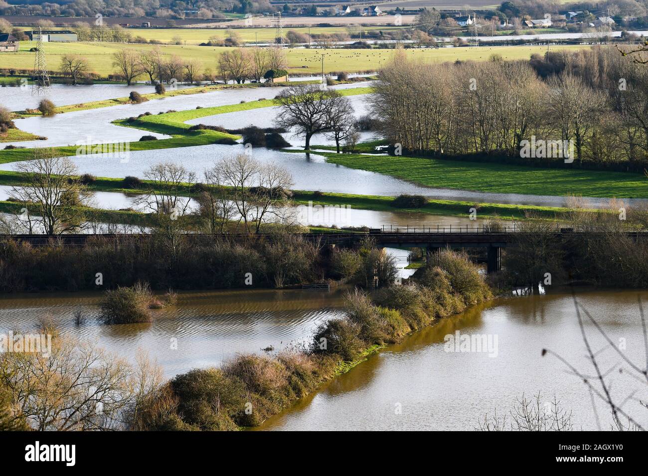 Lewes UK 22nd December 2019 - Flooded fields and farmland at Lewes in East Sussex after overnight rain as more weather and flood warnings have been issued across Britain after days of continual rain : Credit Simon Dack / Alamy Live News Stock Photo
