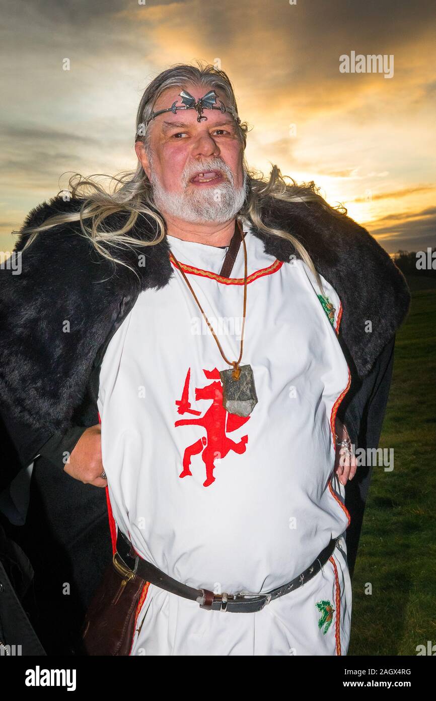 Salisbury, UK. 22nd Dec, 2019. Druids celebrate at sunrise on the shortest day December 22nd 2019. Hundreds of people gathered the famous historic stone circle, in Wiltshire, to celebrate the sunrise on the Winter Solstice the shortest day of the year The event is claimed to be more important in the pagan calendar than the summer solstice because it marks the rebirth of the Sun for the year ahead Credit: David Betteridge/Alamy Live News Stock Photo