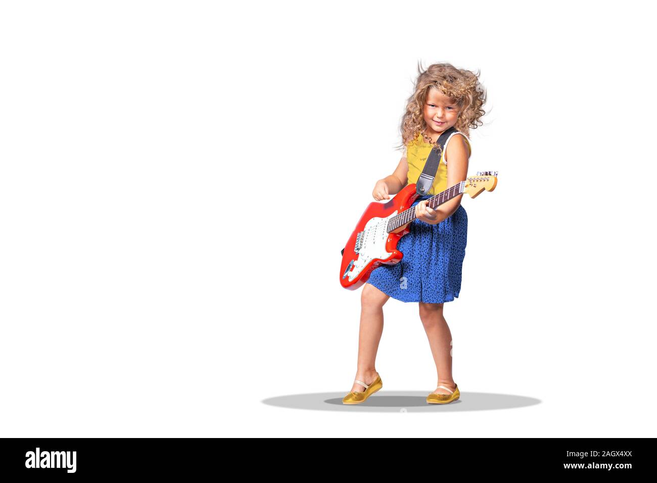 portrait of little girl with a guitar on the stage Stock Photo