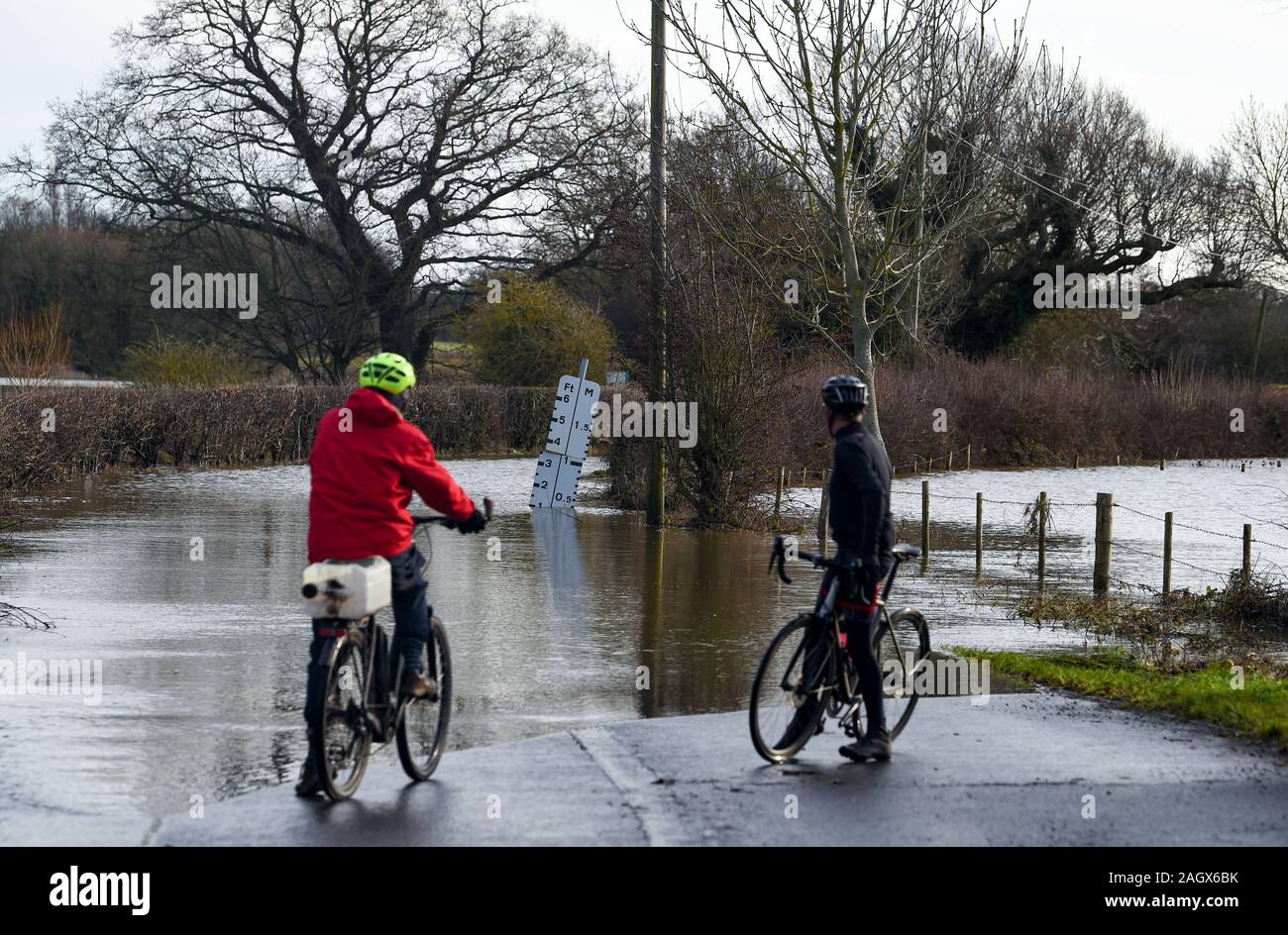 Lewes UK 22nd December 2019 - Flooded road in the village of Barcombe Mills near Lewes in East Sussex as more weather and flood warnings have been issued across Britain after days of rain : Credit Simon Dack / Alamy Live News Stock Photo
