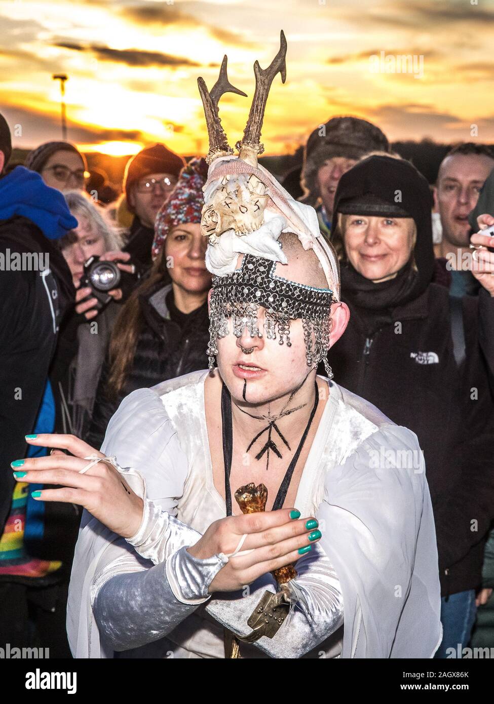 Salisbury, UK. 22nd Dec, 2019. Druids celebrate at sunrise on the shortest day December 22nd 2019. Hundreds of people gathered the famous historic stone circle, in Wiltshire, to celebrate the sunrise on the Winter Solstice the shortest day of the year The event is claimed to be more important in the pagan calendar than the summer solstice because it marks the rebirth of the Sun for the year ahead Credit: David Betteridge/Alamy Live News Stock Photo