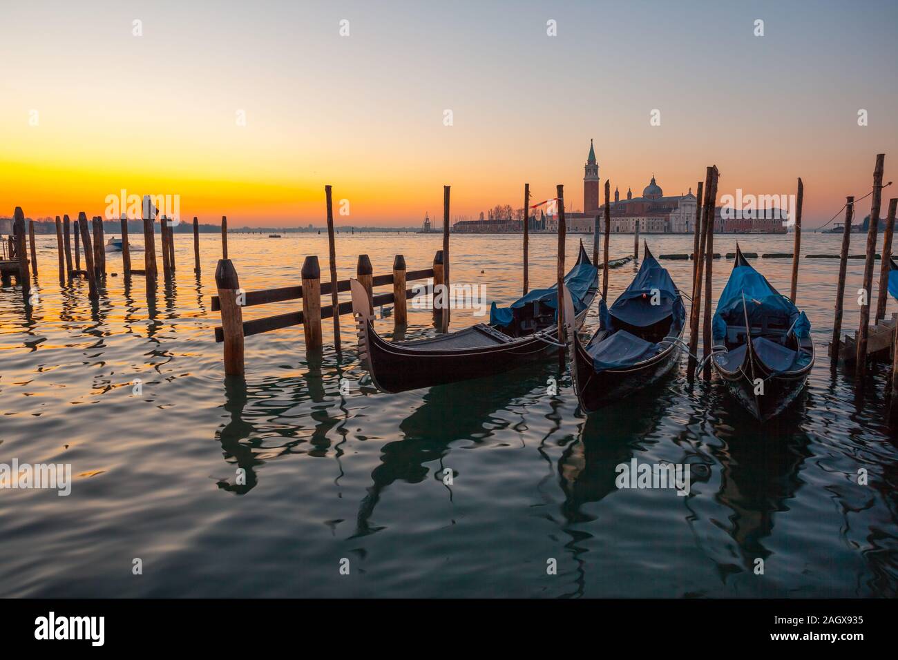 Sunrise at Venice with gondola and island Stock Photo - Alamy