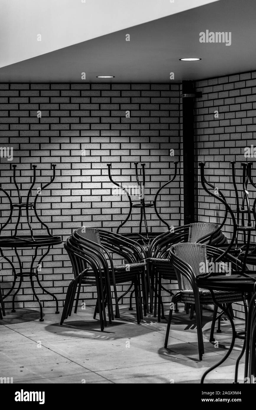 Stacked up tables and chairs Stock Photo Alamy