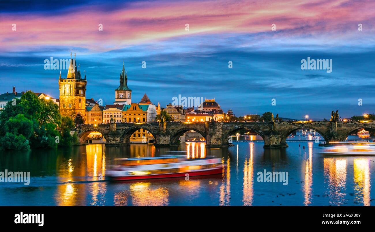 View of dowtown Prague with Charles Bridge over the Vltava river after sunset. Czech Republic Stock Photo