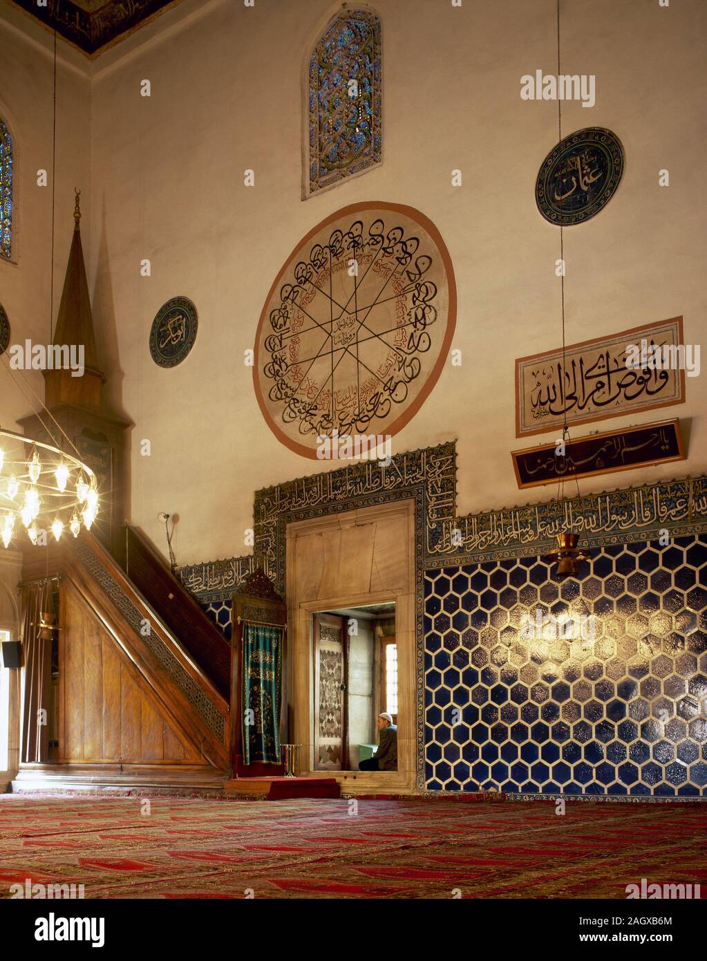 Turkey, Bursa. The Green Mosque or Mosque of Mehmed I. Its construction was supervised by the architect Haci Ivaz Pasha. Ottoman style, 1419-1424. The Prayer Hall of the mosque with green and blue interior tile decorations, and the Minbar (pulpit). Marmara region. Stock Photo