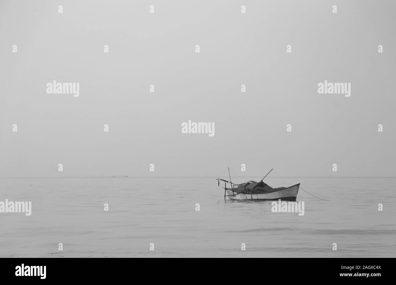 a boat in the sea (bay of bengal ) between fog . Stock Photo