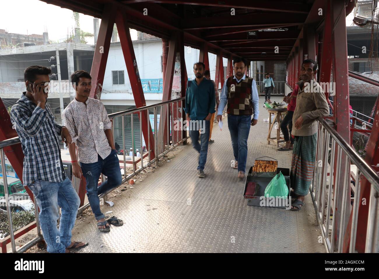 Street hawker 12dec2018, mohakhali Dhaka Bangladesh.A street hawker is standing footbridge and waiting for his customer.photo was taken mohakhali Dhak Stock Photo