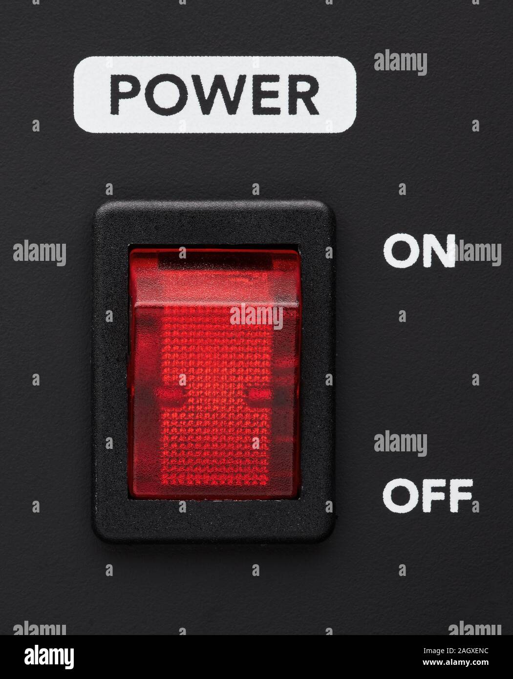 Power on and off electrical switch red button on black background. Close up detail. Stock Photo