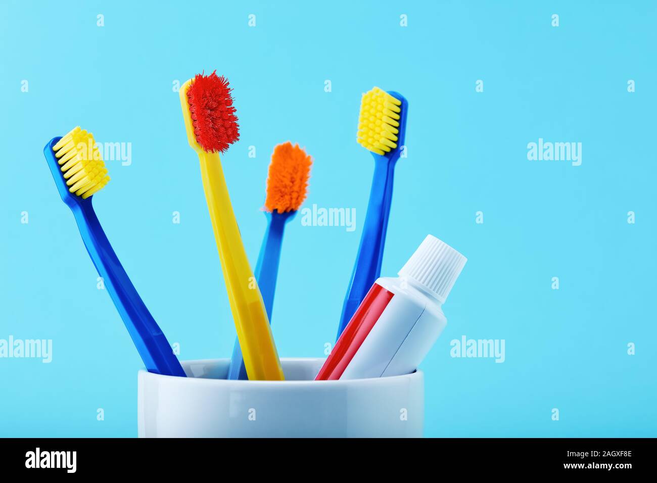 Toothbrush and toothpaste in cup hires stock photography and images