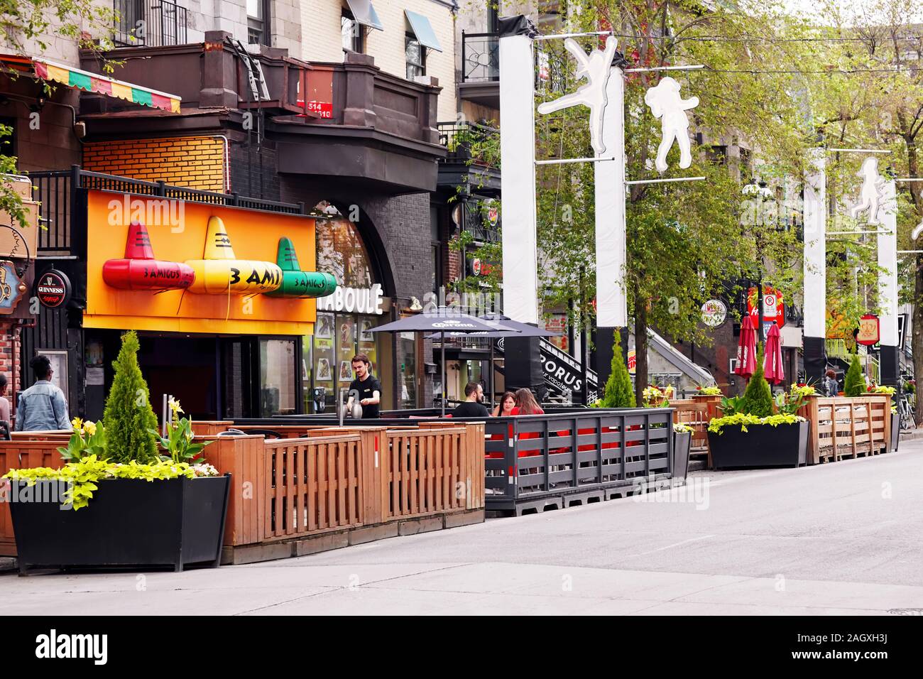 Montreal, Canada June, 2018 People sitting at cafes and bars on