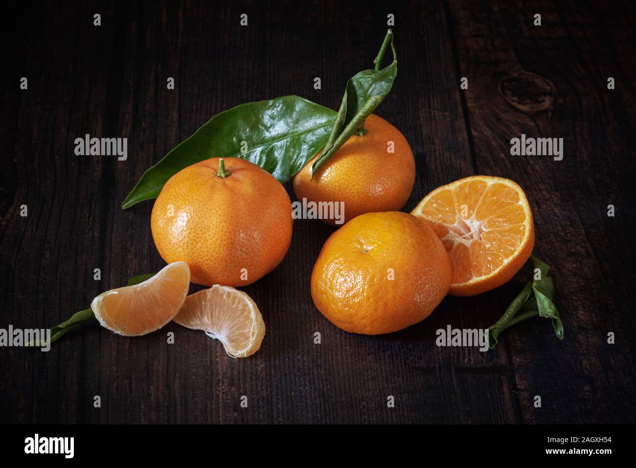 Clementine's on wooden table Stock Photo