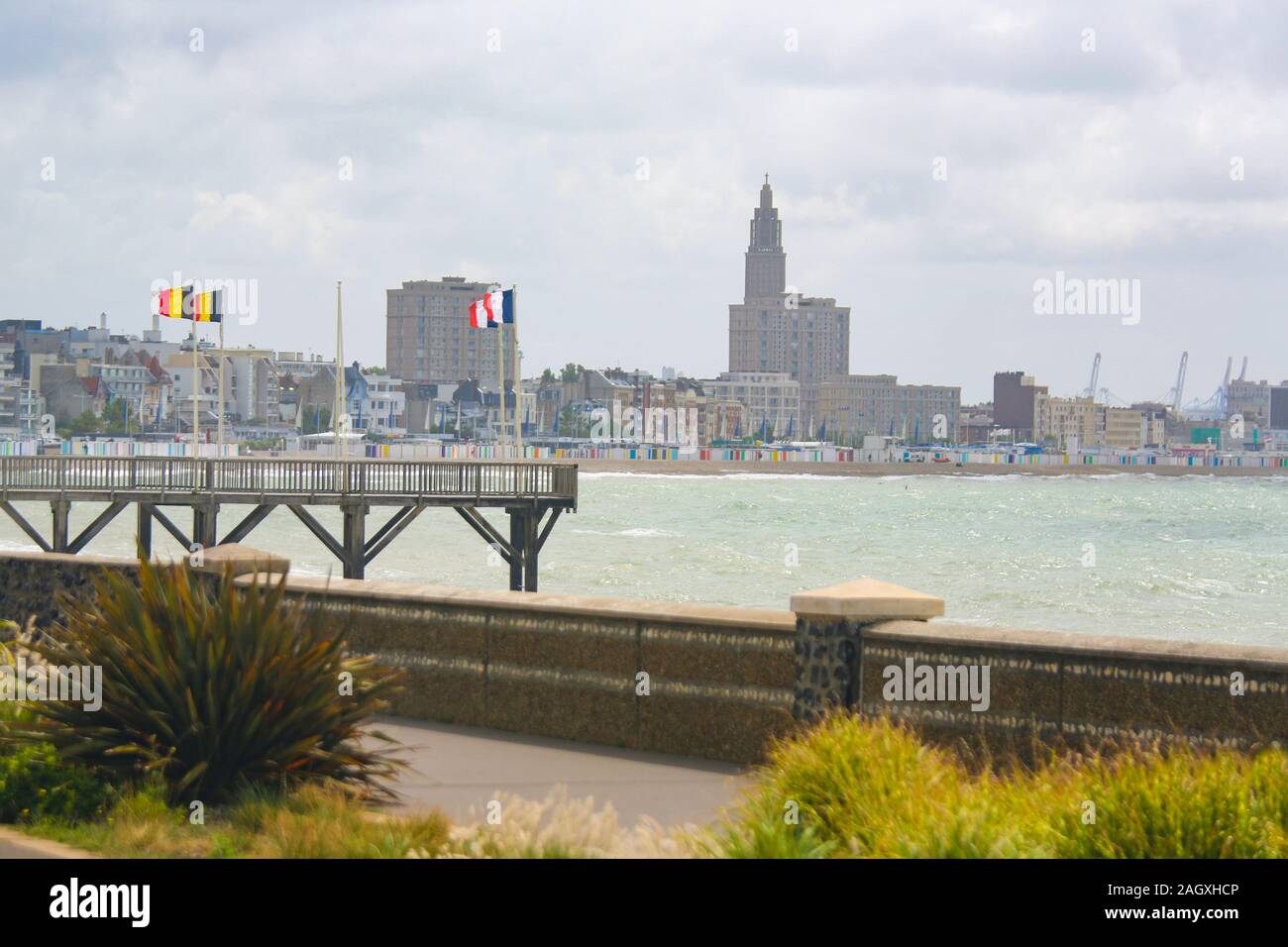 French and Belgian Flags and skyline of the port of Le Havre, Seine-Maritime, Normandy, France. Stock Photo