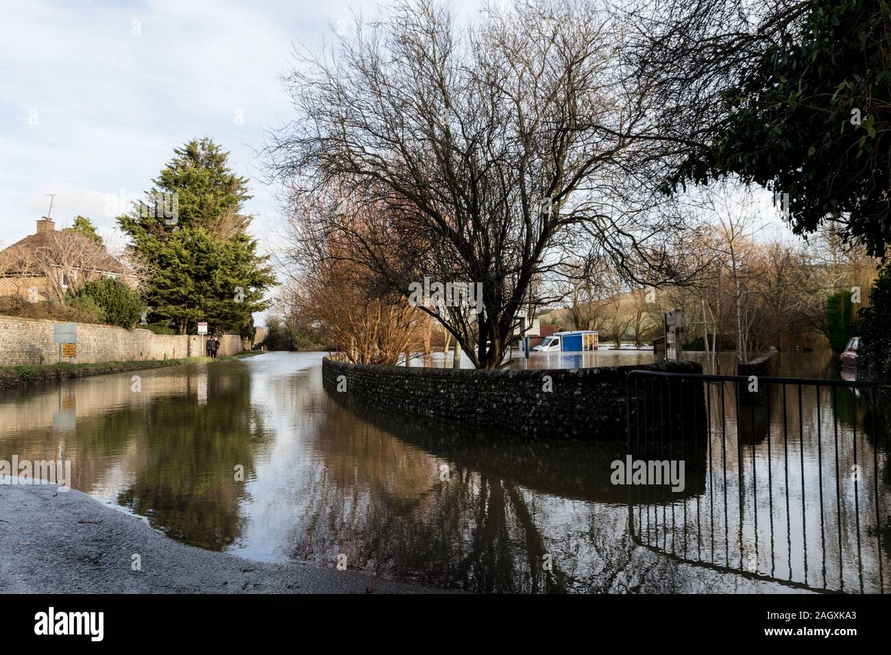 Alfriston, East Sussex, UK. 22nd December 2019. Following several days of heavy rain the road into this East Sussex hamlet town remains flooded. Credit Alan Fraser/Alamy Live News Stock Photo