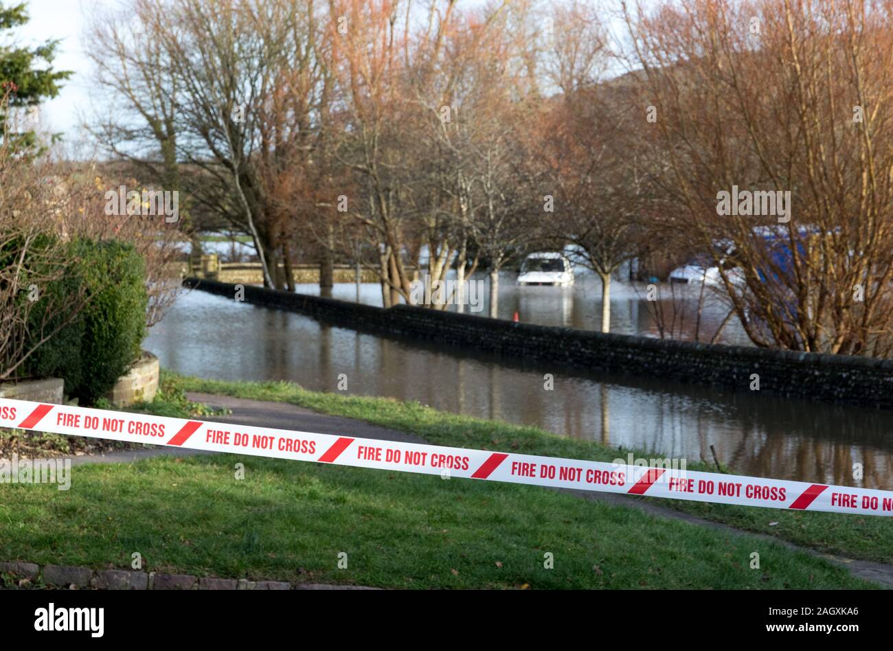 Alfriston, East Sussex, UK. 22nd December 2019. Following several days of heavy rain the road into this East Sussex hamlet town remains flooded. Credit Alan Fraser/Alamy Live News Stock Photo