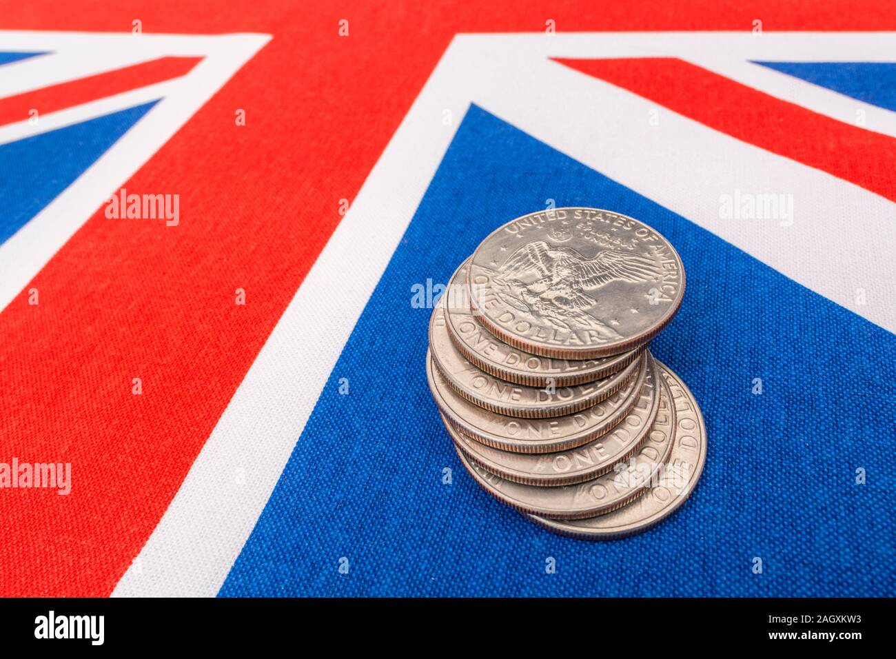 US $1 coins / Silver Dollars & Union Jack. For US Dollar exchange rate concept, US economy, US UK exports, US UK balance of payments, US Holiday money Stock Photo