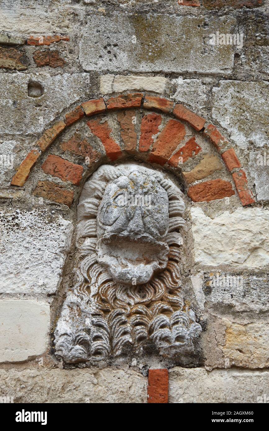 Carved Lion's head on the entrance wall of the Monastery at Ardenica, near Apollonia in Albania Stock Photo