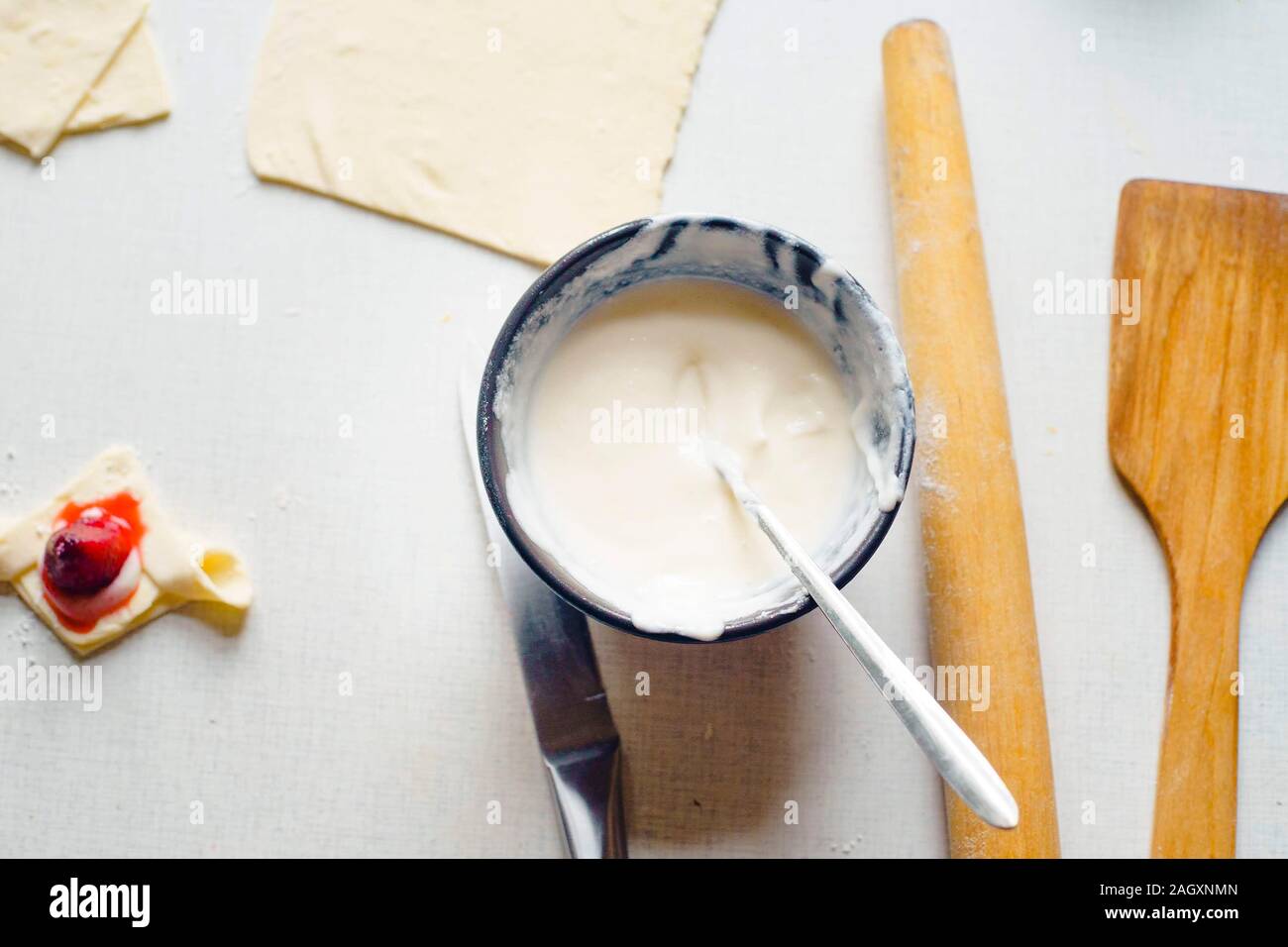 Food Ingredients In Kitchen On White Background A Wooden Spatula