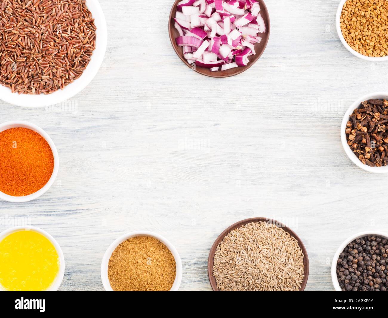 Ingredients for cooking brown rice butter, cumin (jeera), fenugreek, red chili pepper, masala