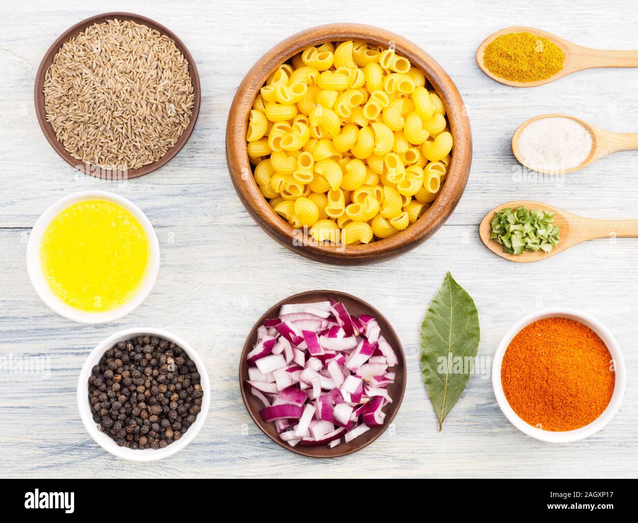 Ingredients for cooking pasta salt, butter (ghi), cumin (jeera), red chili, onion, masala, bay