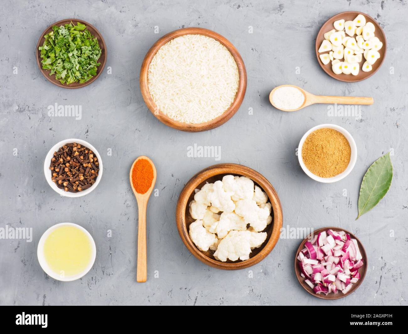 Ingredients for cooking basmati rice butter, salt, cloves, green herbs