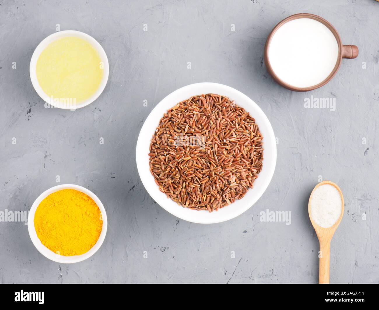 Ingredients for cooking brown rice butter, yogurt, turmeric, cumin