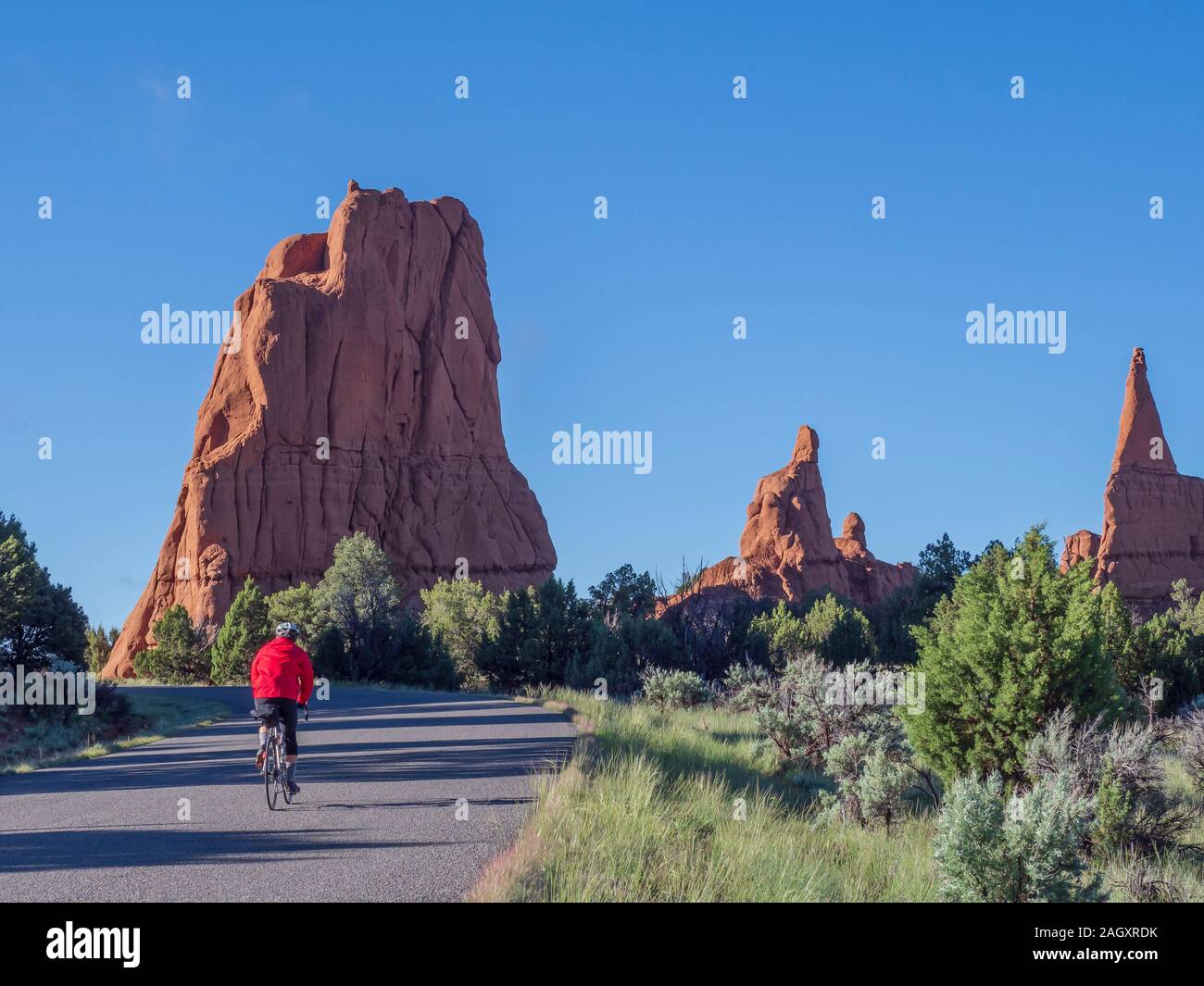 Bicyclist on park roadway, Kodachrome Basin State Park, Cannonville, Utah. Stock Photo