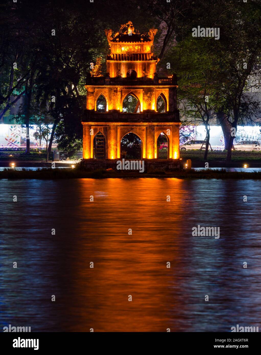 Turtle Tower or Thap Rua lit up at night with reflections in Hoan Kiem Lake, Hanoi, Vietnam, Asia Stock Photo