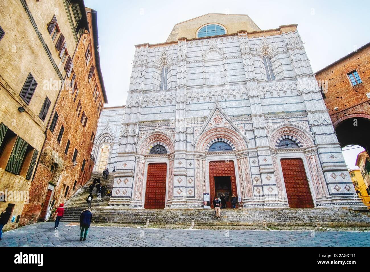 Siena, Italy - 03 March, 2019: Baptistery of San Giovanni, an imposing monument of the city, visited by tourists from all over the world Stock Photo