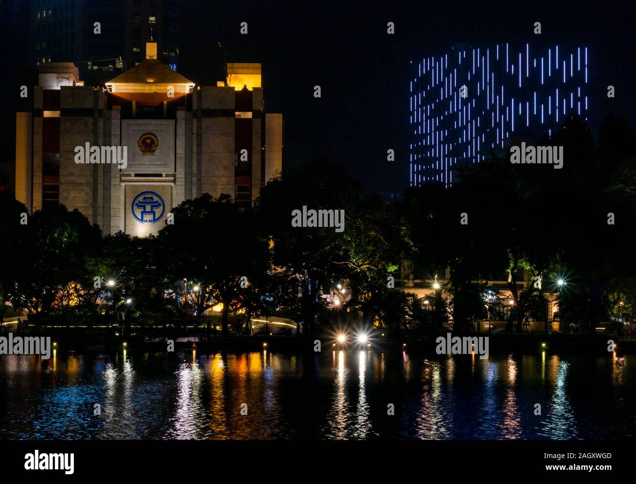 Hanoi Municipal People’s Committee building lit up at night, Hoan Kiem Lake, Hanoi, Vietnam, Asia Stock Photo