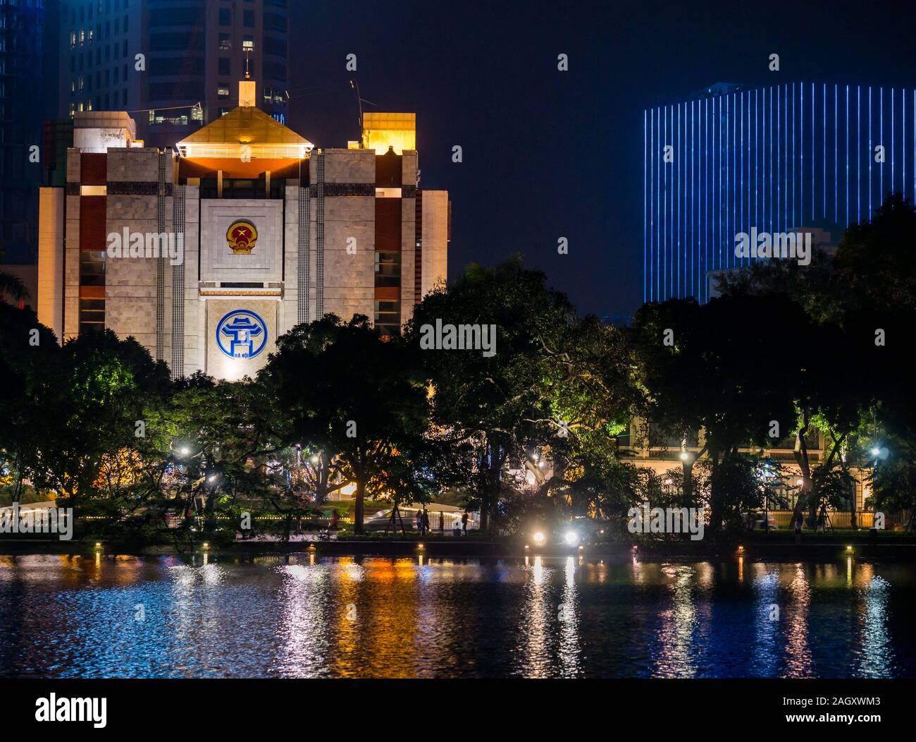Hanoi Municipal People’s Committee building lit up at night, Hoan Kiem Lake, Hanoi, Vietnam, Asia Stock Photo