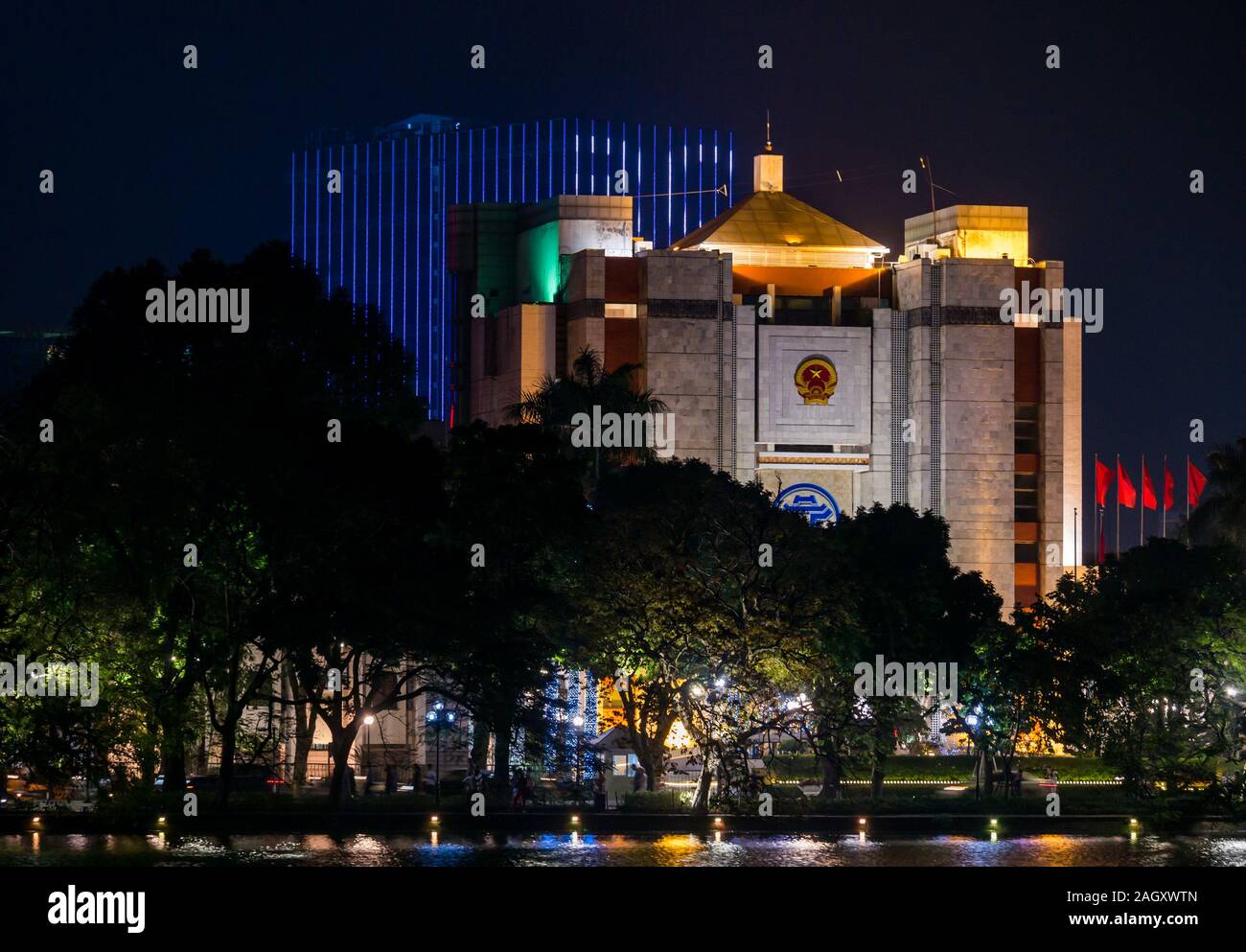 Hanoi Municipal People’s Committee building lit up at night, Hoan Kiem Lake, Hanoi, Vietnam, Asia Stock Photo