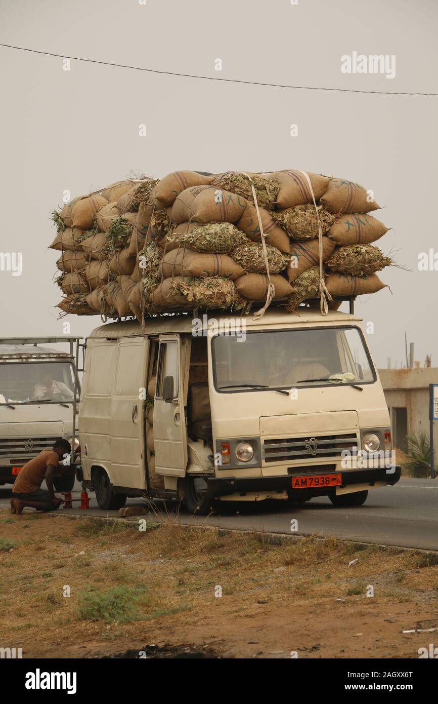 Truck overloaded with plastic containers - Stock Image - C047/7908 -  Science Photo Library