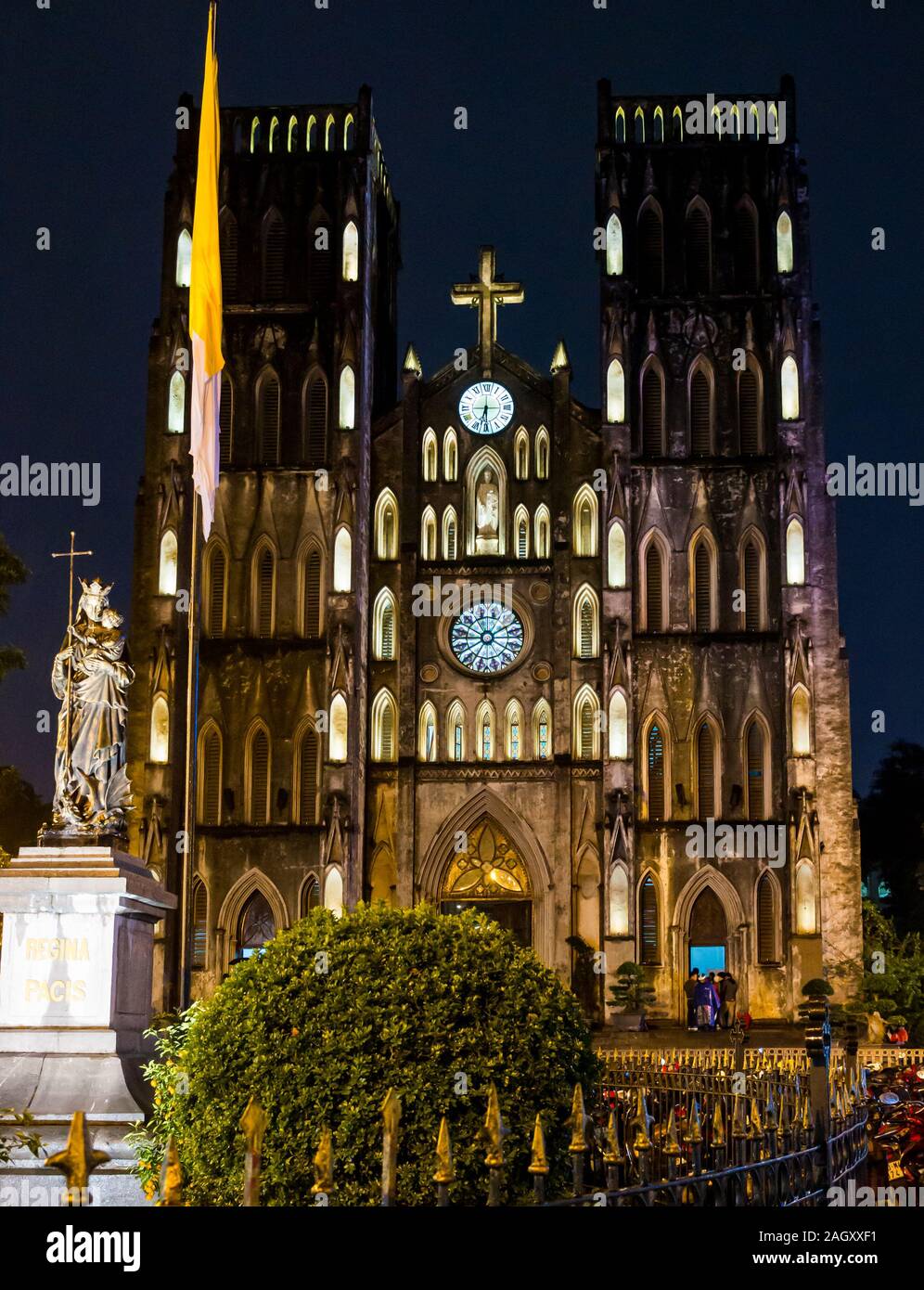 St Joseph's Cathedral lit up at night with Virgin Mary statue, Church