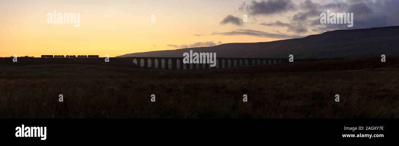 Direct Rail Services class 66 locomotives at Ribblehead viaduct with a Network rail Railhead treatment train ( RHTT ) dealing with autumn leaves Stock Photo