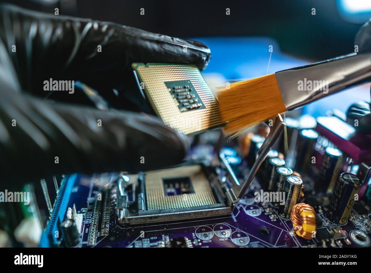 Engineer repairman holding hands in black gloves chip processor, CPU to ...