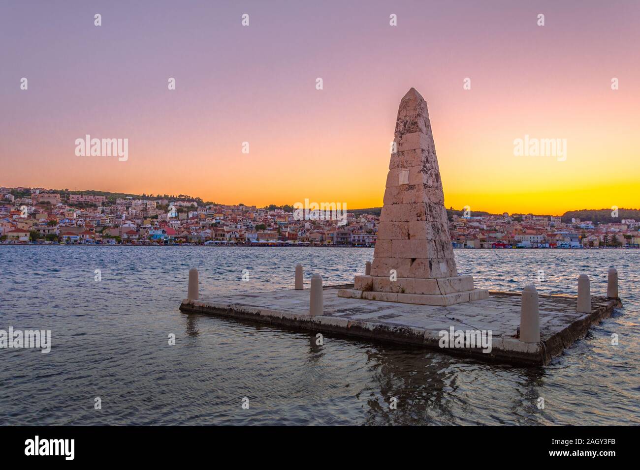 Beautiful panoramic view of the city at sunset and an Obelisk monument in Greek town Argostoli on Kefalonia island (Ionian island) in Greece. Stock Photo
