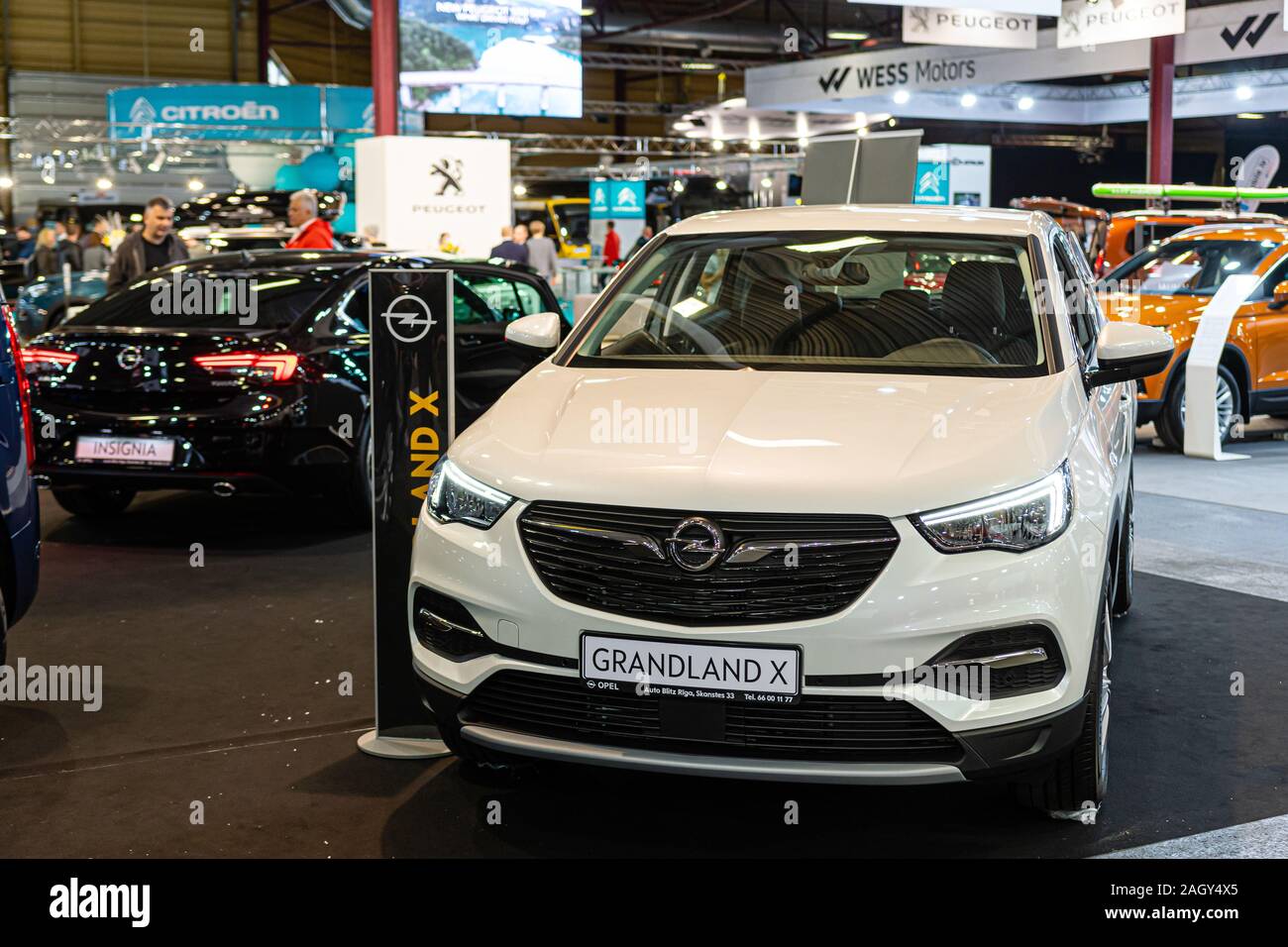 Riga Latvia April 12 19 People In The Showroom Opt For New Suv Cars Image Stock Photo Alamy