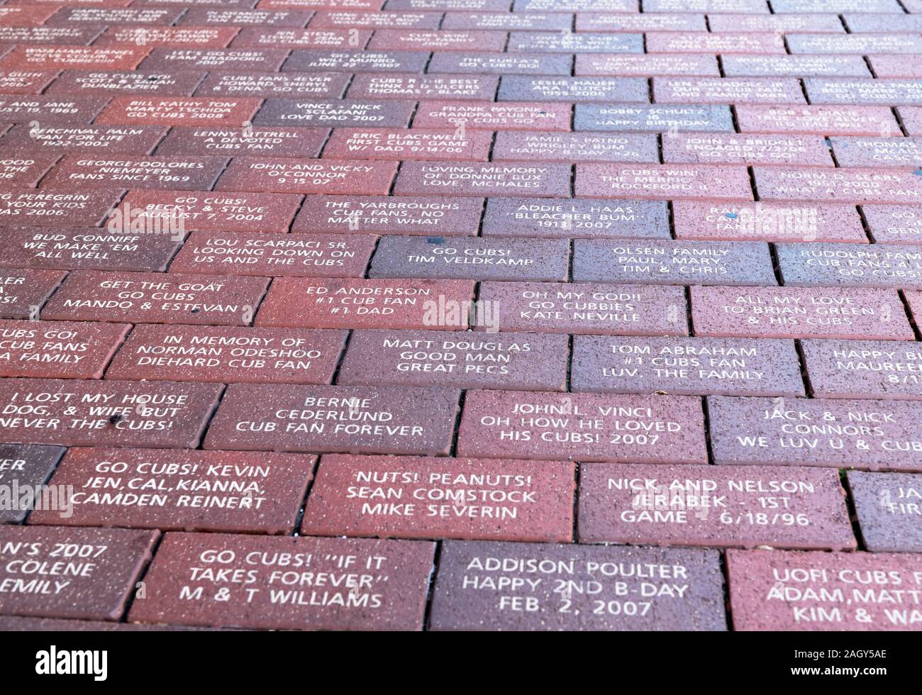 Commemorative brick pavers, paid for by fans, on the sidewalk outside Wrigley Field baseball park, Chicago, Illinois, USA Stock Photo