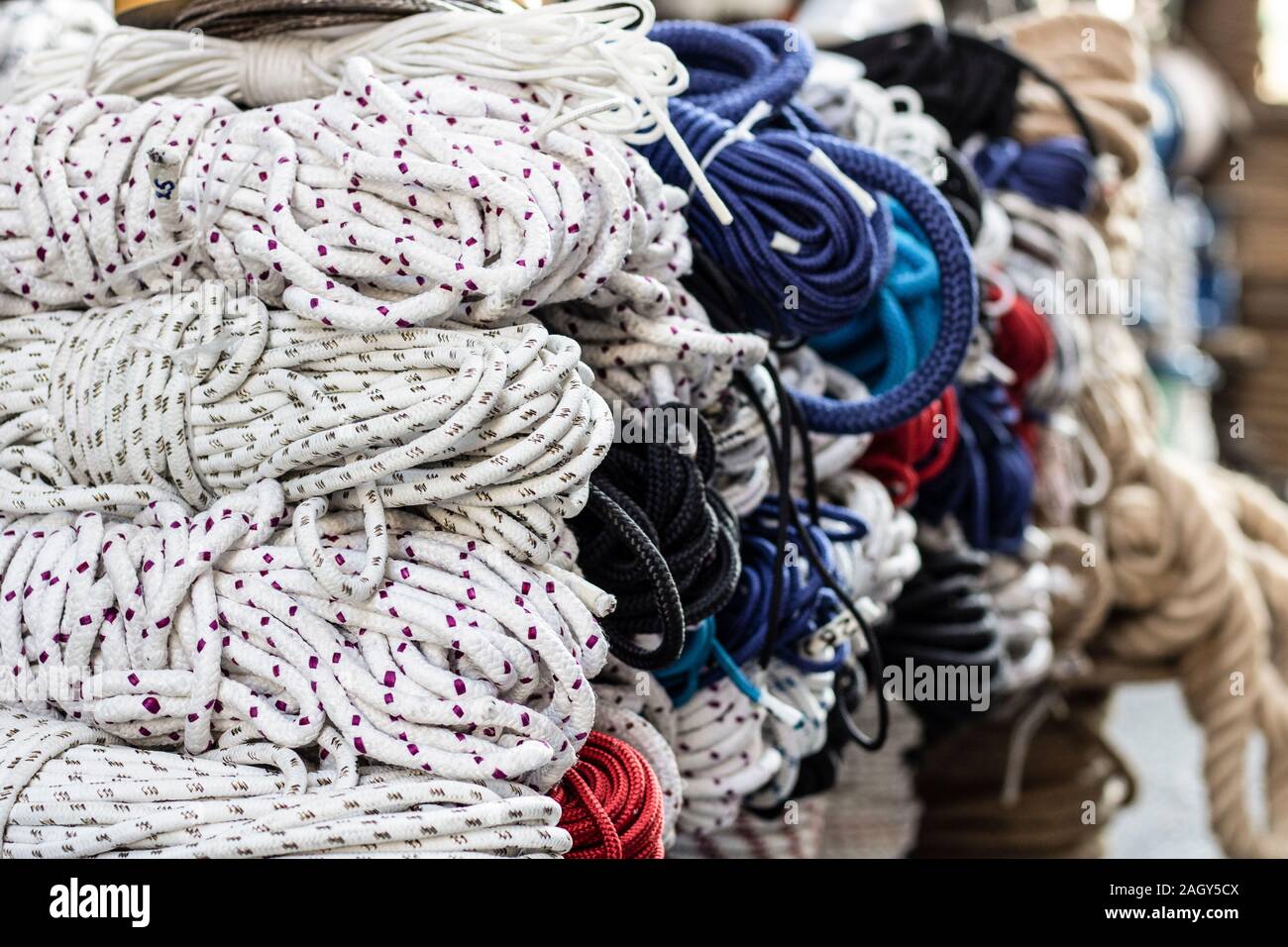 Climbing equipment: dynamic rope, set of climbing chocks, quickdraws and belay device Stock Photo