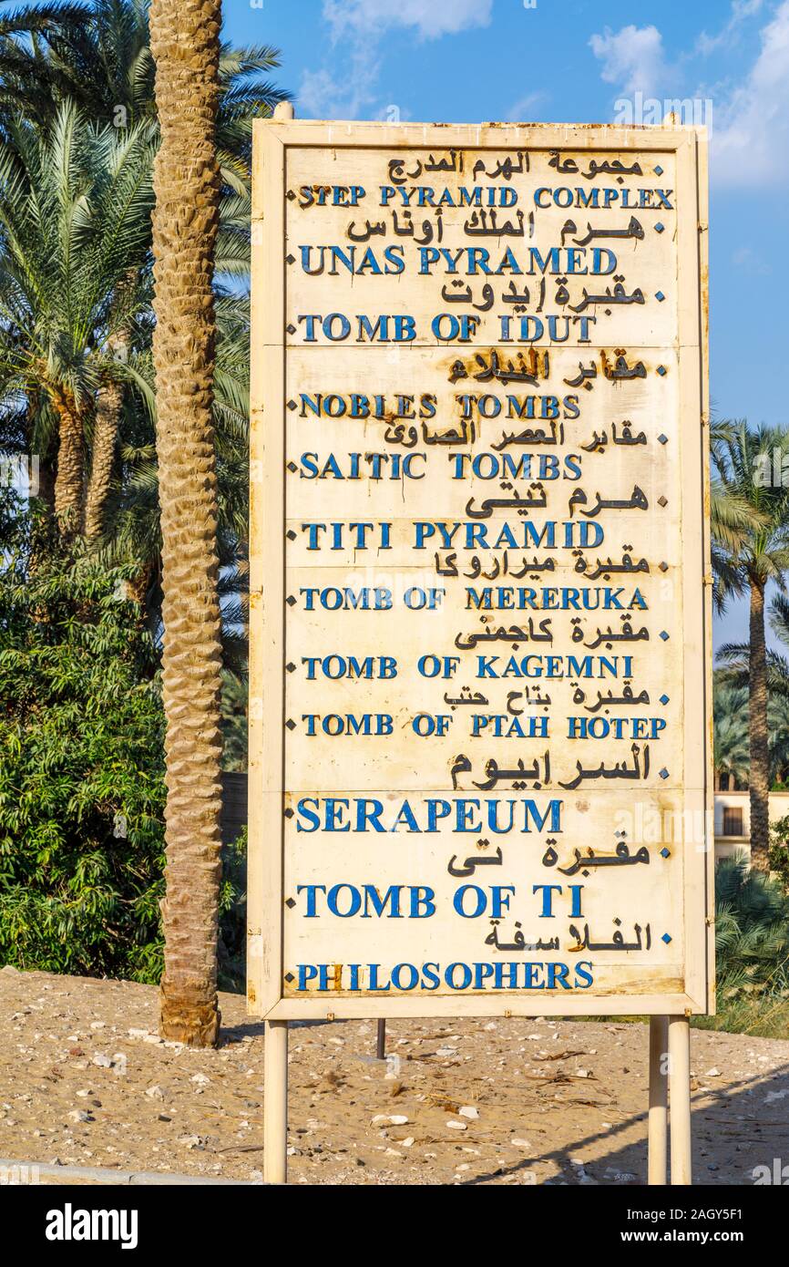 Sign board at the entrance to Saqqara necropolis site near Mwmphis, outside Cairo, Egypt listing the tombs and other attractions Stock Photo