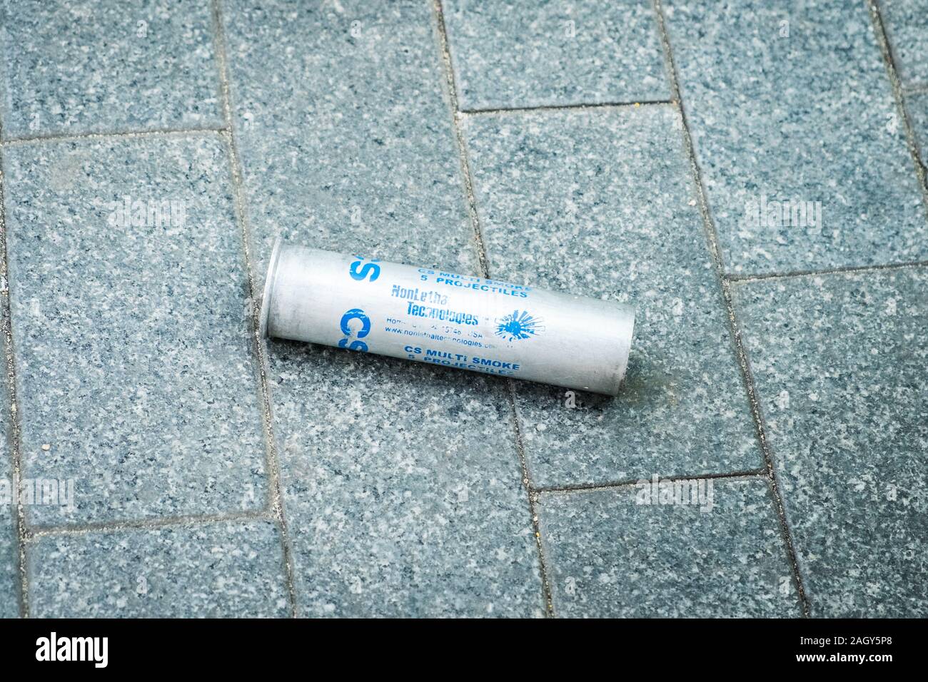 HongKong - November, 2019:  Cs gas can on floor, tear gas projectile used as anti riot weapon during the 2019 HongKong protests Stock Photo