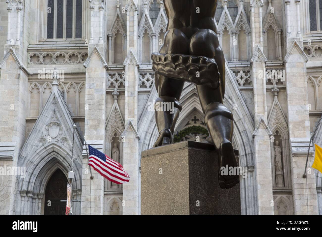 Coming out of Rockefeller Center seeing the rear end of Atlas with Saint Patrick's Cathedral across the street on 5th Avenue. Stock Photo