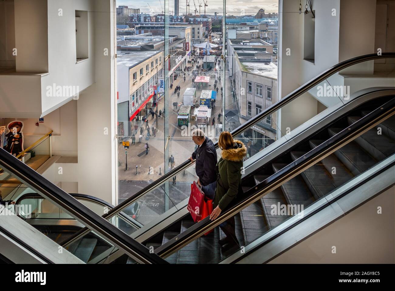 Unusual view through window from 3rd floor Of Department Store of Bristol Christmas Market and stalls  in Bristol, Avon, UK on 21 December 2019 Stock Photo