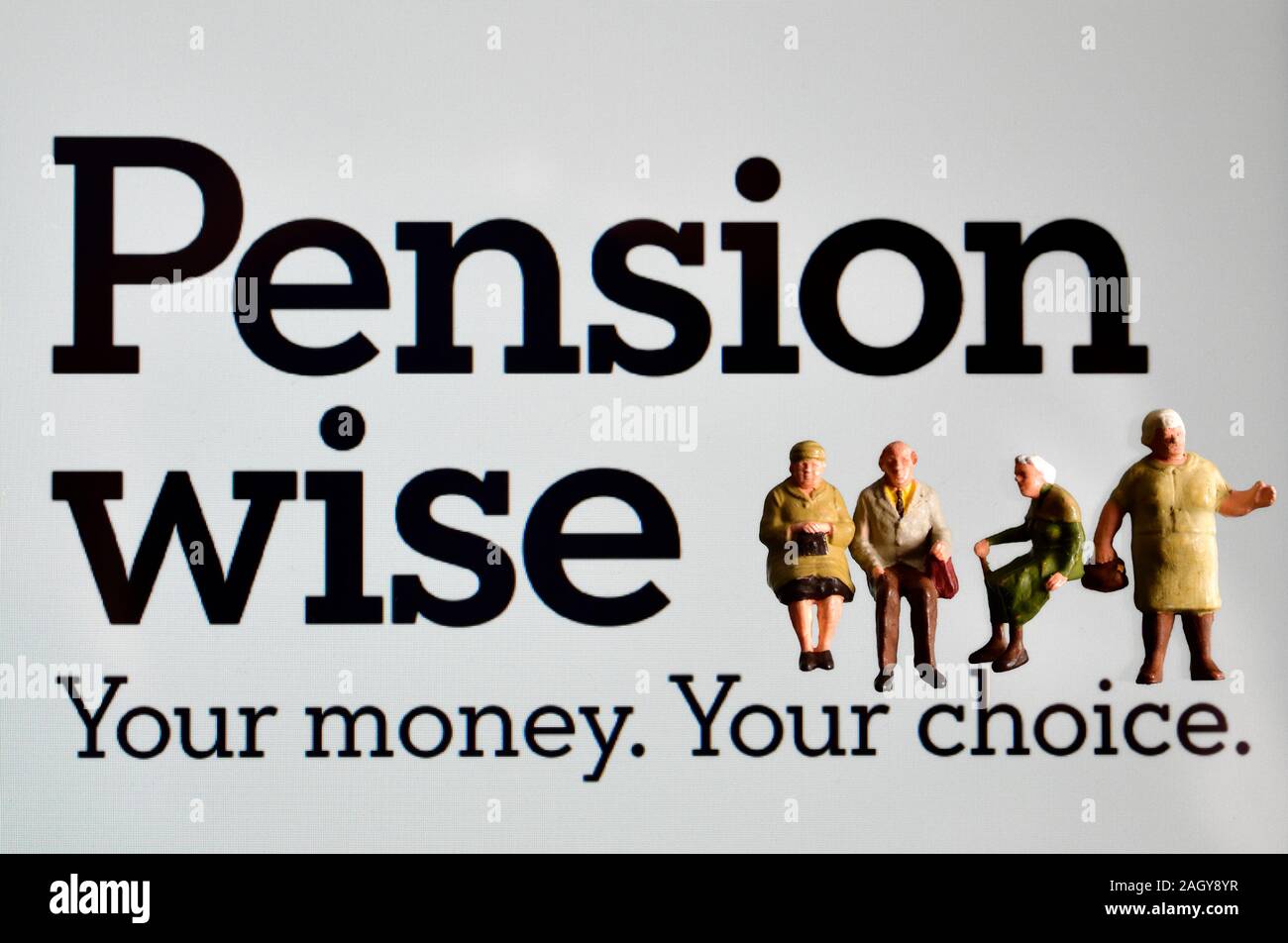 Pension wise government advice website with miniature figurines Stock Photo