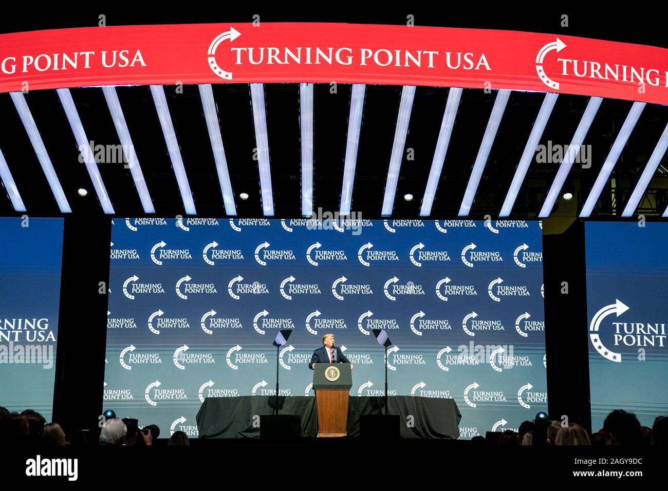 U.S President Donald Trump delivers remarks at the Turning Point USA 5th annual Student Action Summit at the Palm Beach County Convention Center December 21, 2019 in West Palm Beach, Florida. Trump rallied the youth conservative group with wild claims on wind turbines and attacks on his opponents. Stock Photo