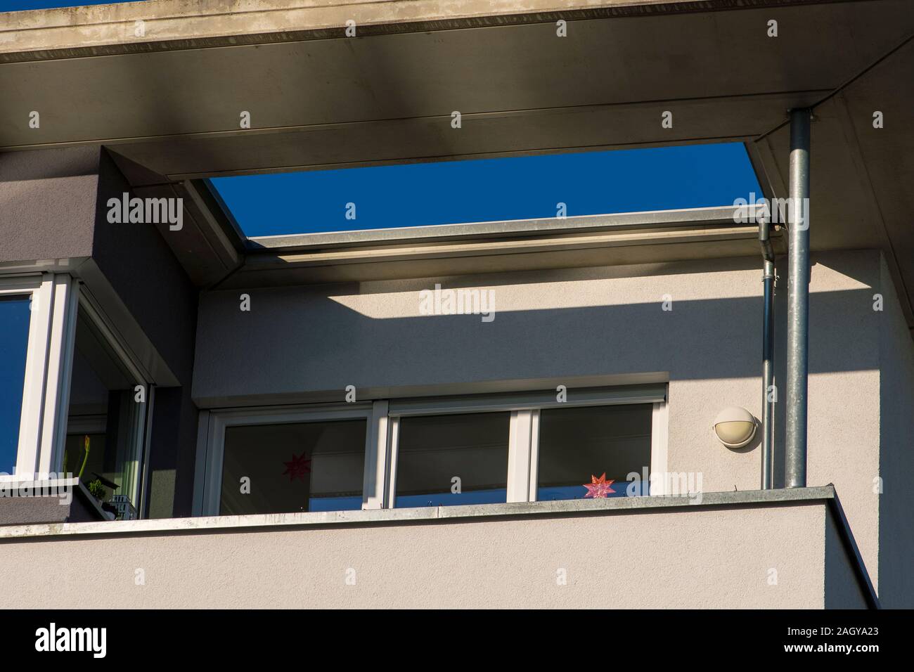 House facade with balcony and roof overhang Stock Photo Alamy