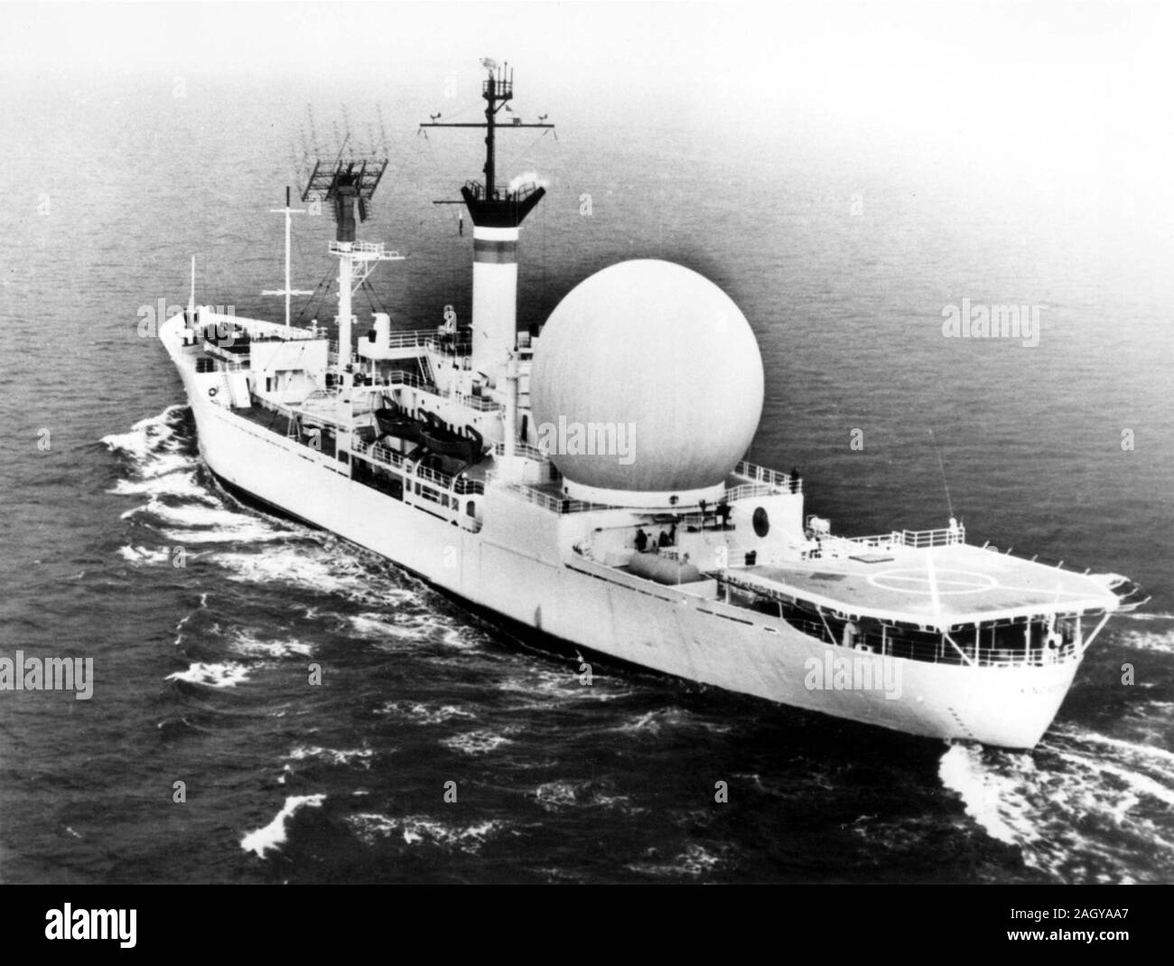 In 1962, the United States Navy built the first satellite communications ship, the U.S.N.S. Kingsport. The picture shows a 53- foot white plastic dome protecting a 30-foot stabilized parabolic antenna. Stock Photo