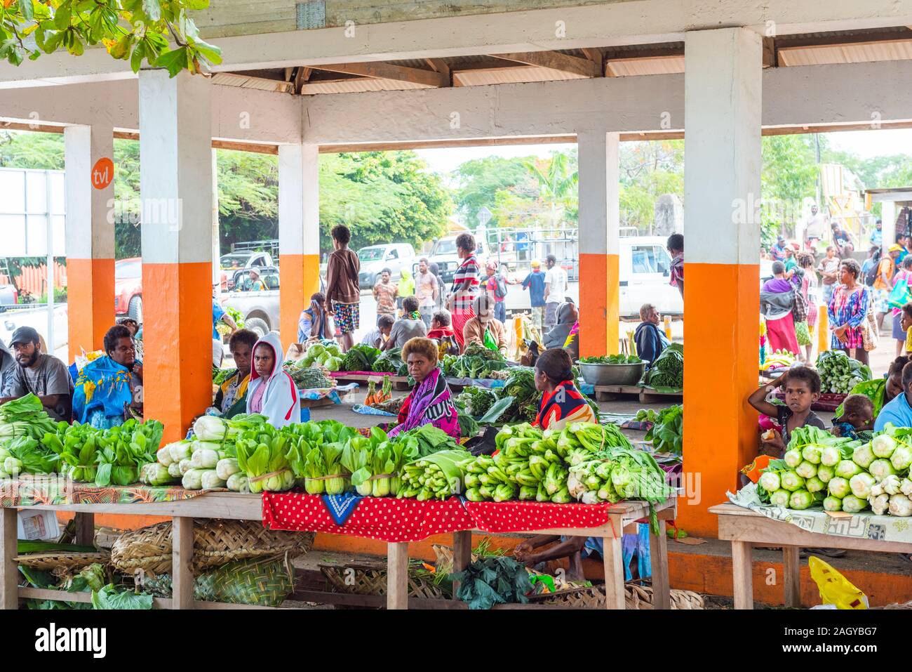 TANNA ISLAND, VANUATU - JULY 22, 2019: Women sell vegetables at the ...