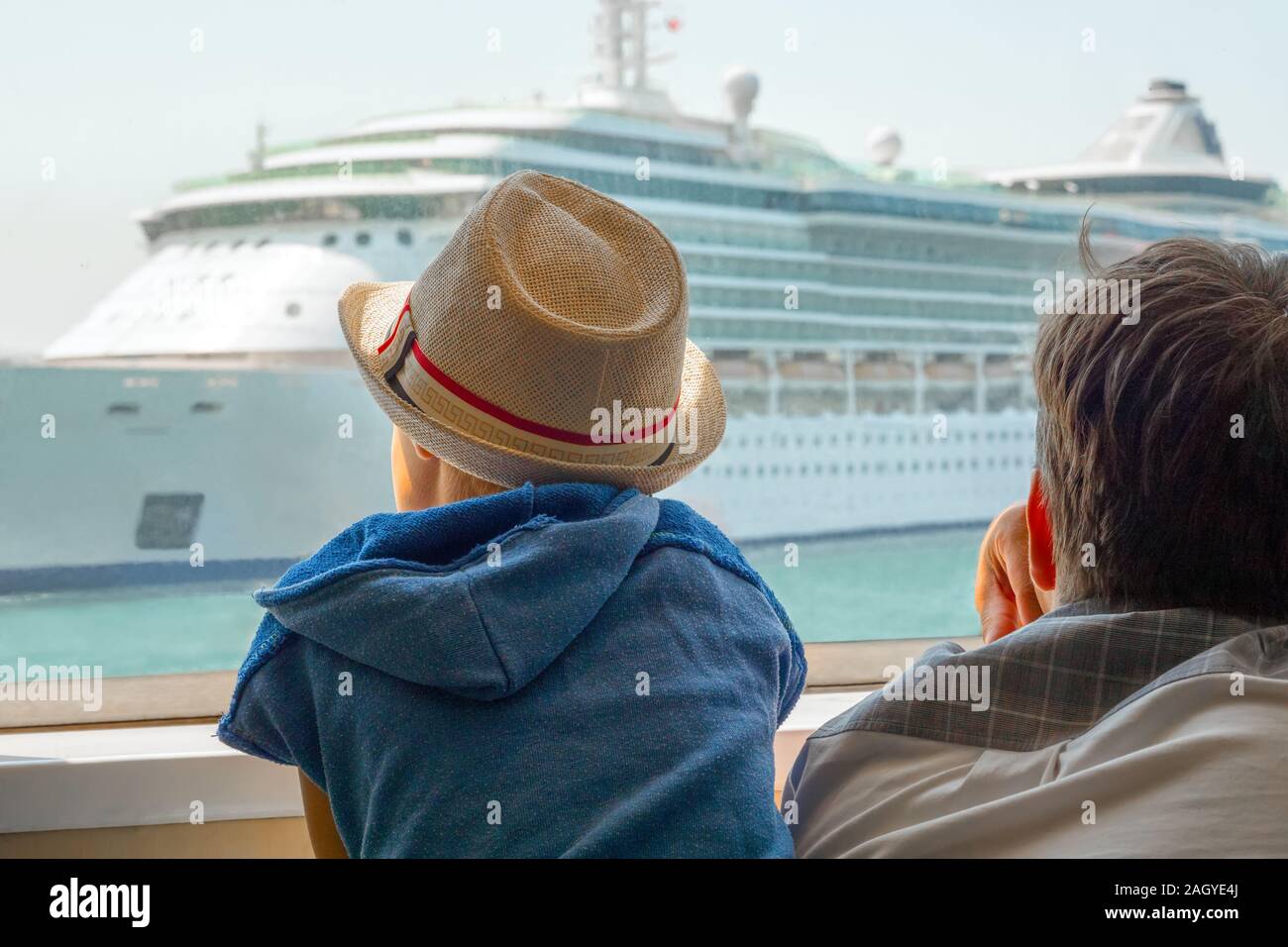Father and son travel in Europe, Greece. Happy family time. Happy father and son enjoying the fascinating view on liner, ship. Reflections on traveling. Spending time with family. Christmas time Stock Photo